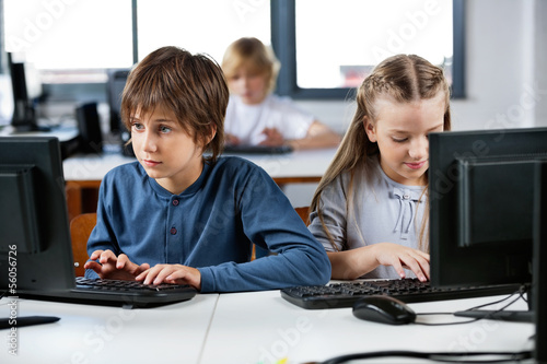 Photo: Schoolchildren Using Desktop Pc In Computer Lab Schoolchildren Using Desktop Pc In Computer Lab
