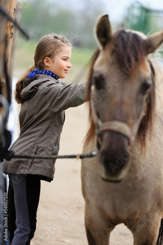 Photo: Horse and lovely equestrian girl Horse and lovely equestrian girl