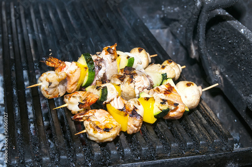 Photo: skewers of seafood grilling skewers of seafood grilling