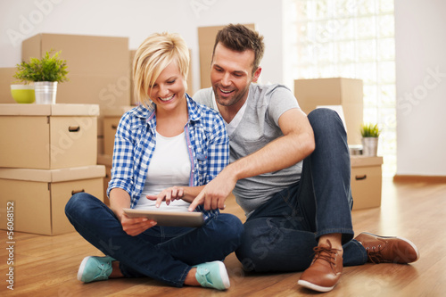 Photo: Smiling couple buying new furniture for their home Smiling couple buying new furniture for their home