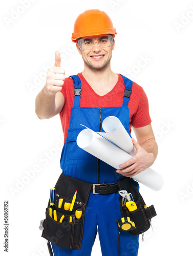Photo: handyman with paper showing thumbs up sign handyman with paper showing thumbs up sign
