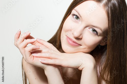 Photo: Portrait of beautiful young woman face Portrait of beautiful young woman face