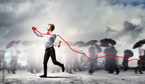 Photo: Businessman drawing graph Businessman drawing graph
