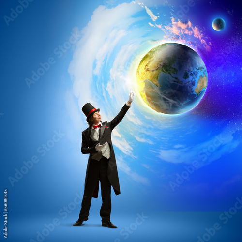 Photo: Magician with globe Magician with globe