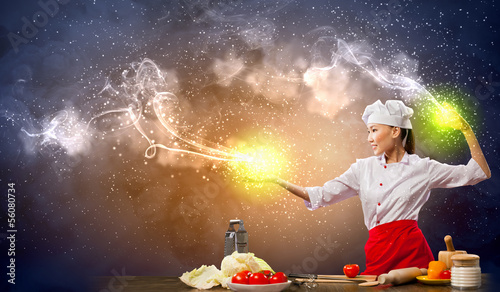 Photo: Asian female cooking with magic Asian female cooking with magic