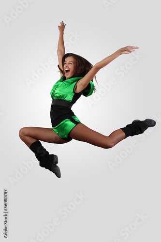 Photo: Young female dancer against white background Young female dancer against white background