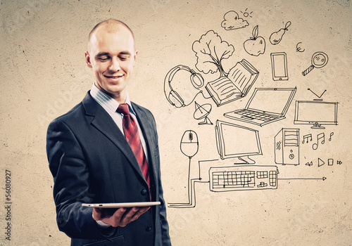 Photo: Businessman with ipad in hands Businessman with ipad in hands