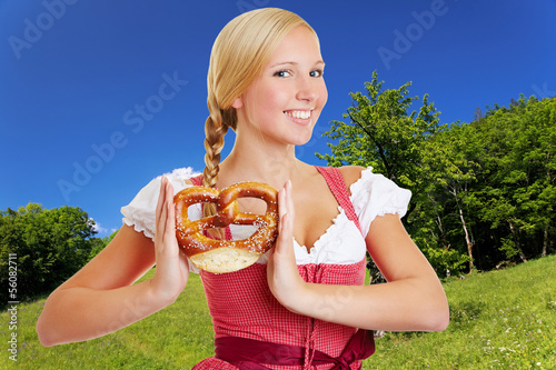 Photo: Woman in dirndl in bavarian landscape Woman in dirndl in bavarian landscape