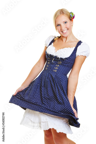 Photo: Happy woman in dirndl dancing Happy woman in dirndl dancing