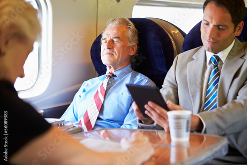 Photo: Businessman Resting On Train Journey Businessman Resting On Train Journey