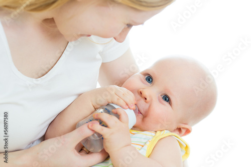 Photo: mother feeding baby from bottle mother feeding baby from bottle