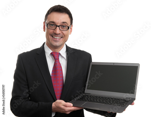 Photo: Smiling businessman with laptop computer Smiling businessman with laptop computer