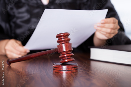 Photo: Female Judge Reading Verdict Female Judge Reading Verdict