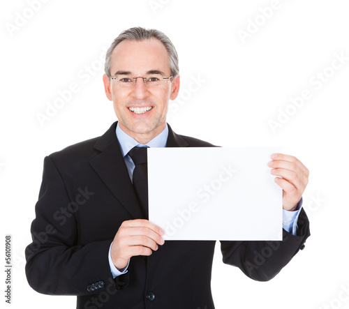 Photo: Businessman With Blank Card Businessman With Blank Card