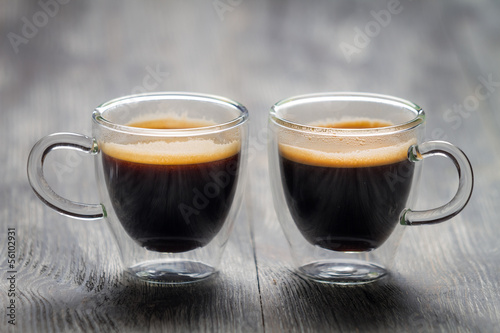Photo: Closeup of two small cups with espresso Closeup of two small cups with espresso