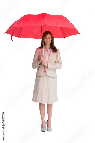 Photo: Attractive businesswoman holding red umbrella Attractive businesswoman holding red umbrella