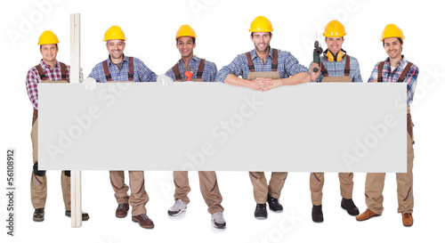 Photo: Group Of Workers With Empty Placard Group Of Workers With Empty Placard