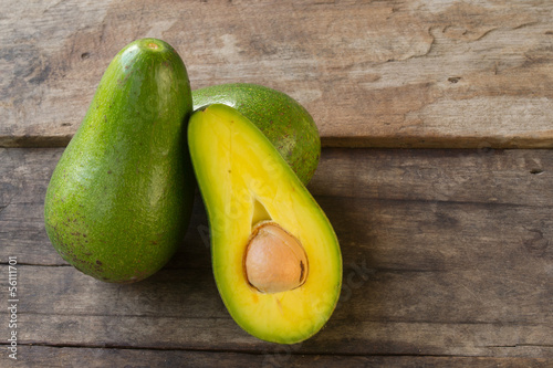 Photo: Avocado on wood background Avocado on wood background