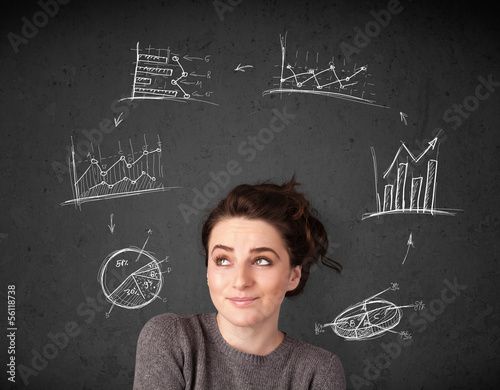 Photo: Young woman thinking with charts circulation around her head Young woman thinking with charts circulation around her head