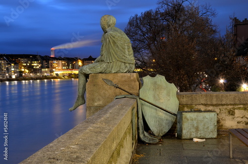 Photo: Sitting Helvetia statue on the river Rhine in Basel, Switzerland Sitting Helvetia statue on the river Rhine in Basel, Switzerland