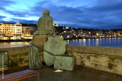 Photo: Sitting Helvetia statue on the river Rhine in Basel, Switzerland Sitting Helvetia statue on the river Rhine in Basel, Switzerland