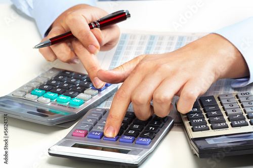 Photo: Hand with calculator. Hand with calculator.