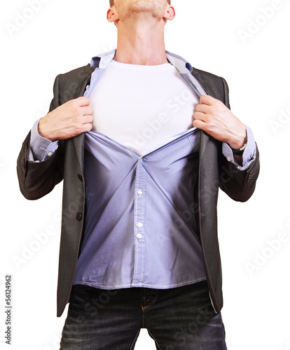 Photo: Superhero. Image of young man tearing his shirt off isolated on Superhero. Image of young man tearing his shirt off isolated on
