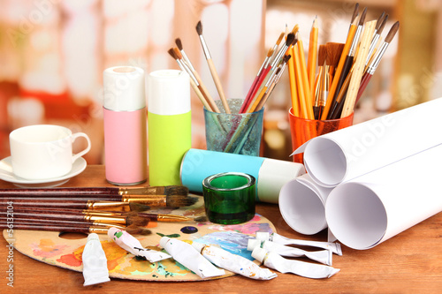 Photo: Artistic equipment: paint, brushes and art palette Artistic equipment: paint, brushes and art palette