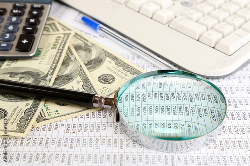 Photo: Financial information and money close-up Financial information and money close-up