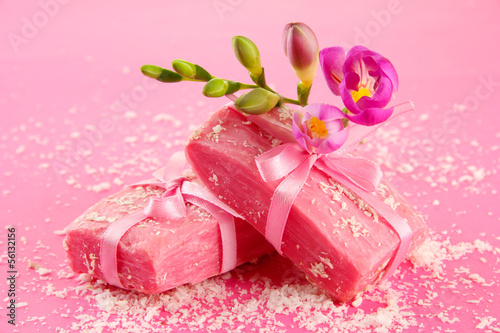 Photo: Natural handmade soap, on pink background Natural handmade soap, on pink background