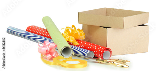 Photo: Materials and accessories for wrapping gifts isolated on white Materials and accessories for wrapping gifts isolated on white