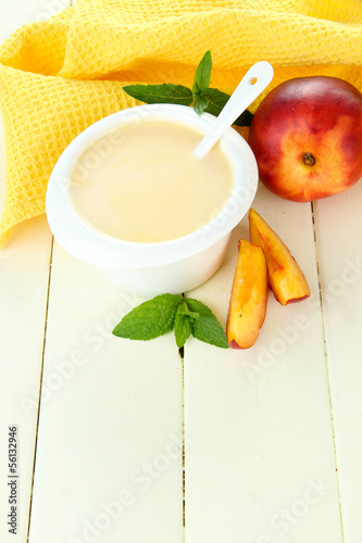 Photo: Delicious yogurt with fruit on table close-up Delicious yogurt with fruit on table close-up