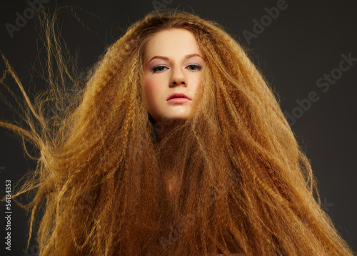 Photo: long-haired curly redhead woman long-haired curly redhead woman