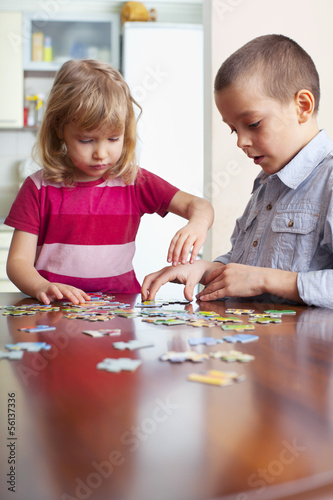 Photo: Children, playing puzzles Children, playing puzzles