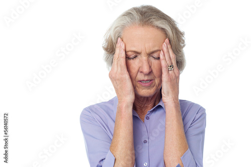 Photo: Old lady suffering from headache Old lady suffering from headache