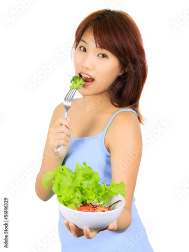 Photo: Young asain woman with a bowl of vegetable salad Young asain woman with a bowl of vegetable salad