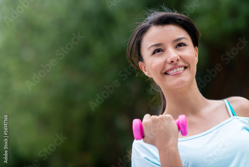 Photo: Fit woman lifting weights Fit woman lifting weights