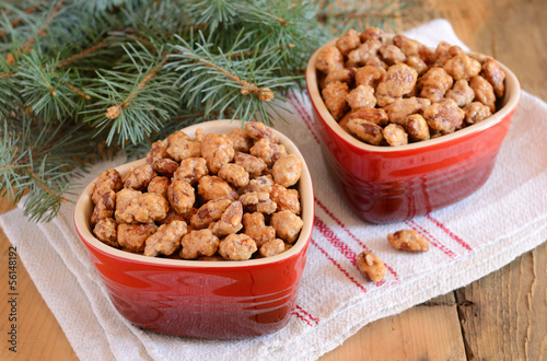 Photo: Sugared almonds and Christmas tree branches Sugared almonds and Christmas tree branches