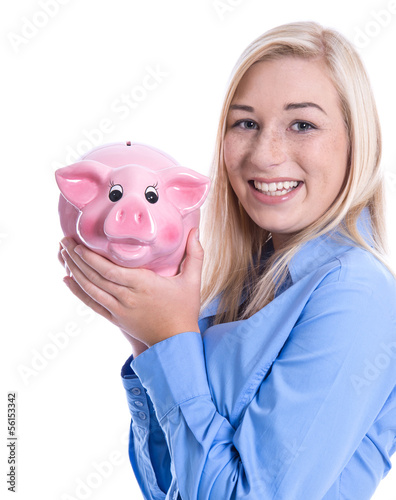 Photo: Junges Mädchen isoliert in blauer Bluse lachend mit Sparschwein Junges Mädchen isoliert in blauer Bluse lachend mit Sparschwein
