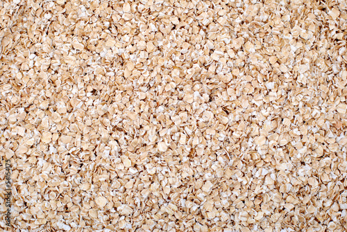 Photo: Porridge oats or oatmeal background Porridge oats or oatmeal background
