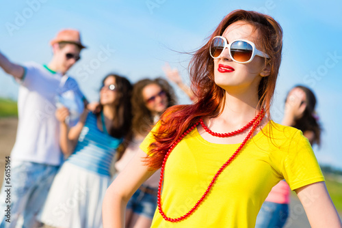 Photo: stylish young woman in sunglasses stylish young woman in sunglasses