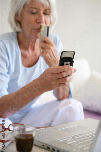 Photo: Senior woman shopping on-line Senior woman shopping on-line