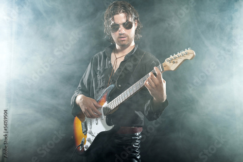 Photo: Psychedelic rock guitarist with long brown hair and beard. Weari Psychedelic rock guitarist with long brown hair and beard. Weari