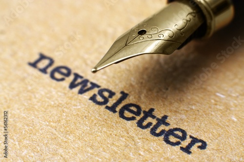 Photo: Newsletter and pen Newsletter and pen