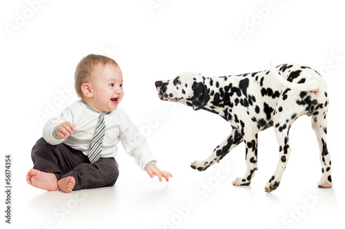 Photo: baby boy playing with puppy dog baby boy playing with puppy dog