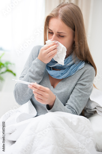 Photo: Young woman having a cold Young woman having a cold