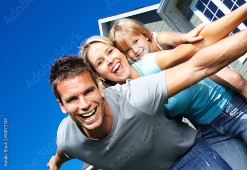 Photo: Happy family near the house Happy family near the house