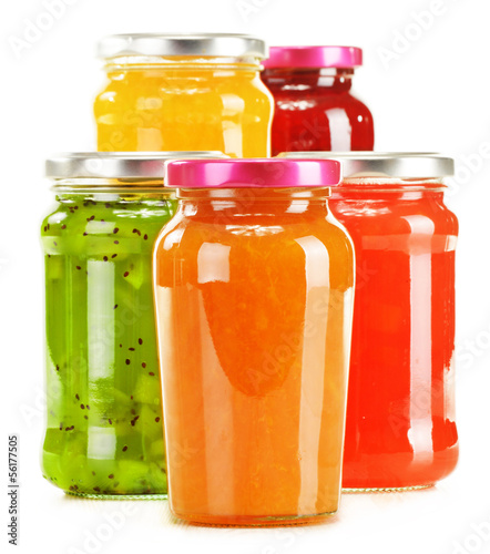 Photo: Jars of fruity jams isolated on white background Jars of fruity jams isolated on white background