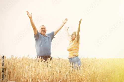 Photo: Old people over field background Old people over field background