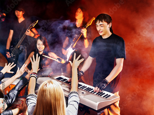 Photo: Band playing musical instrument. Band playing musical instrument.